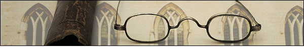 Banner: For more information. Photo of windows of an old architecture building in the background, and eye glasses in the foreground.
